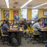 Students sit at desks in a classroom