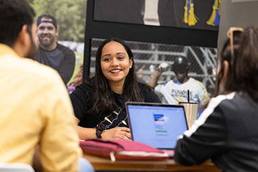 PNW students collaborate at a conference table